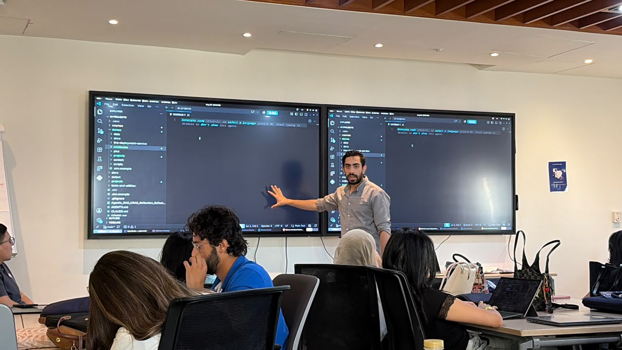 Pointing at a screen while explaining an agentic workflow to trainees